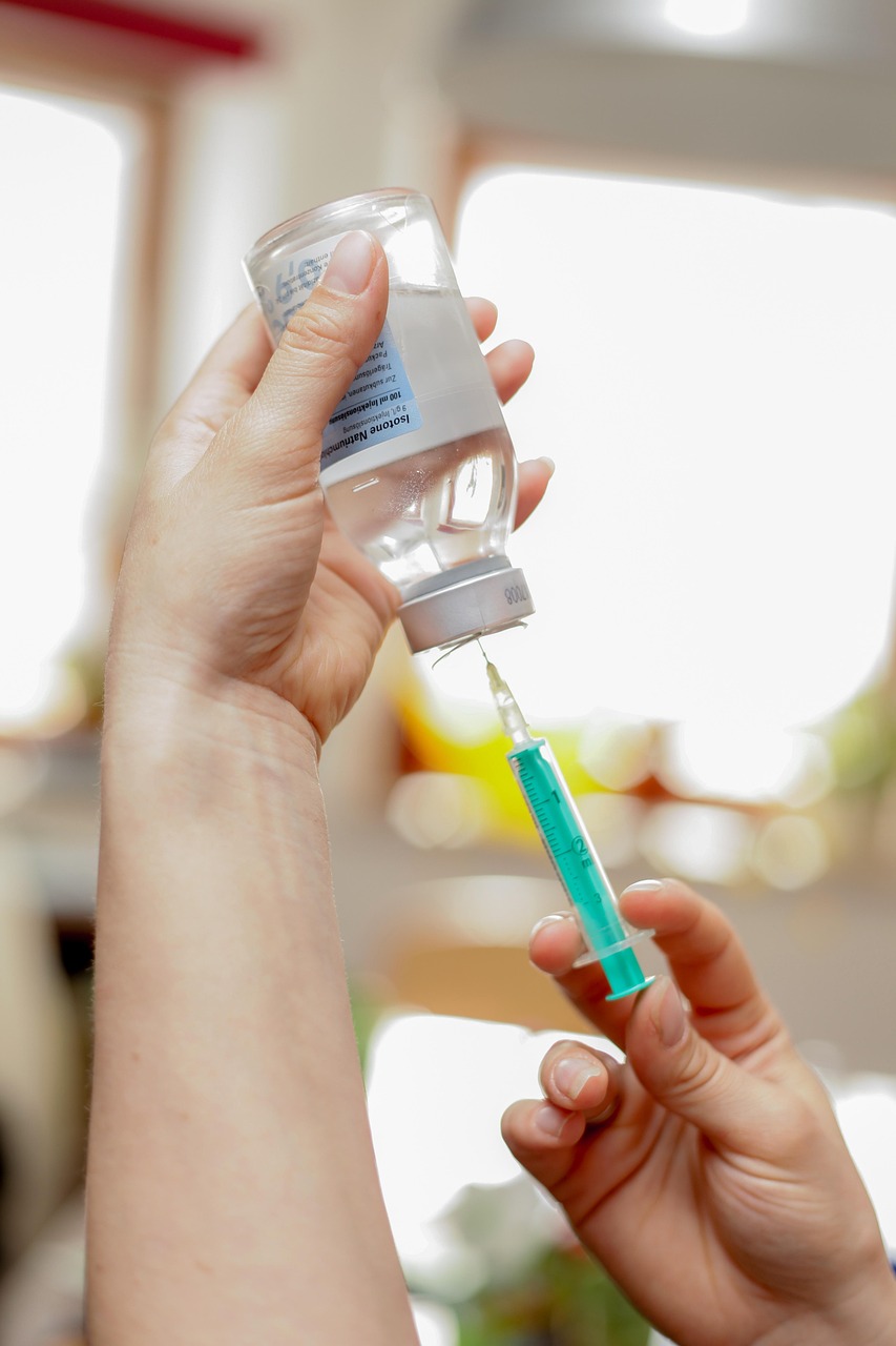 A clinician preparing a syringe
